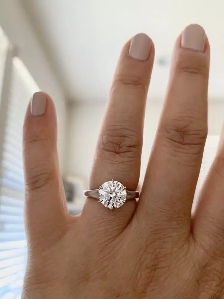 Whiteflash customer review with engagement ring on finger from yelp